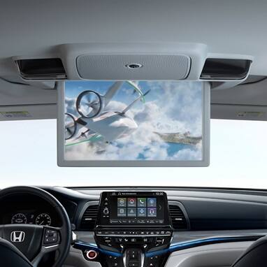 2027 Honda Odyssey trim rear entertainment screen playing video inside the spacious van 3 row cabin layout (Minivan).
